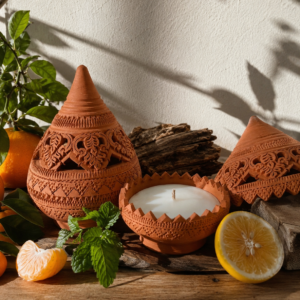 Handcrafted terracotta scented candle with carved Thai pottery, fresh mint, yuzu, tangerine, and rosewood by Maison Miko.